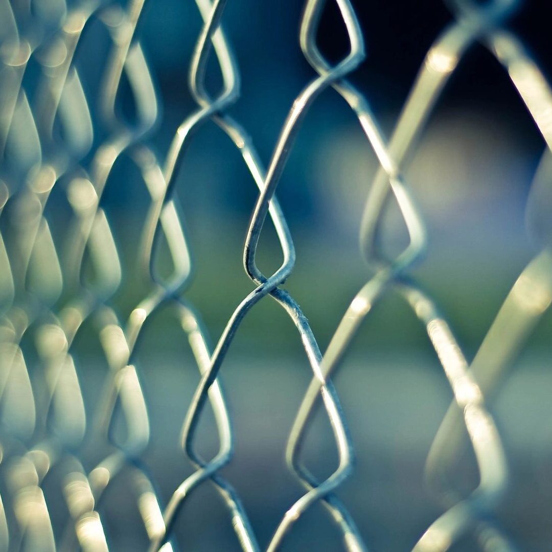 A close up of the chain link fence