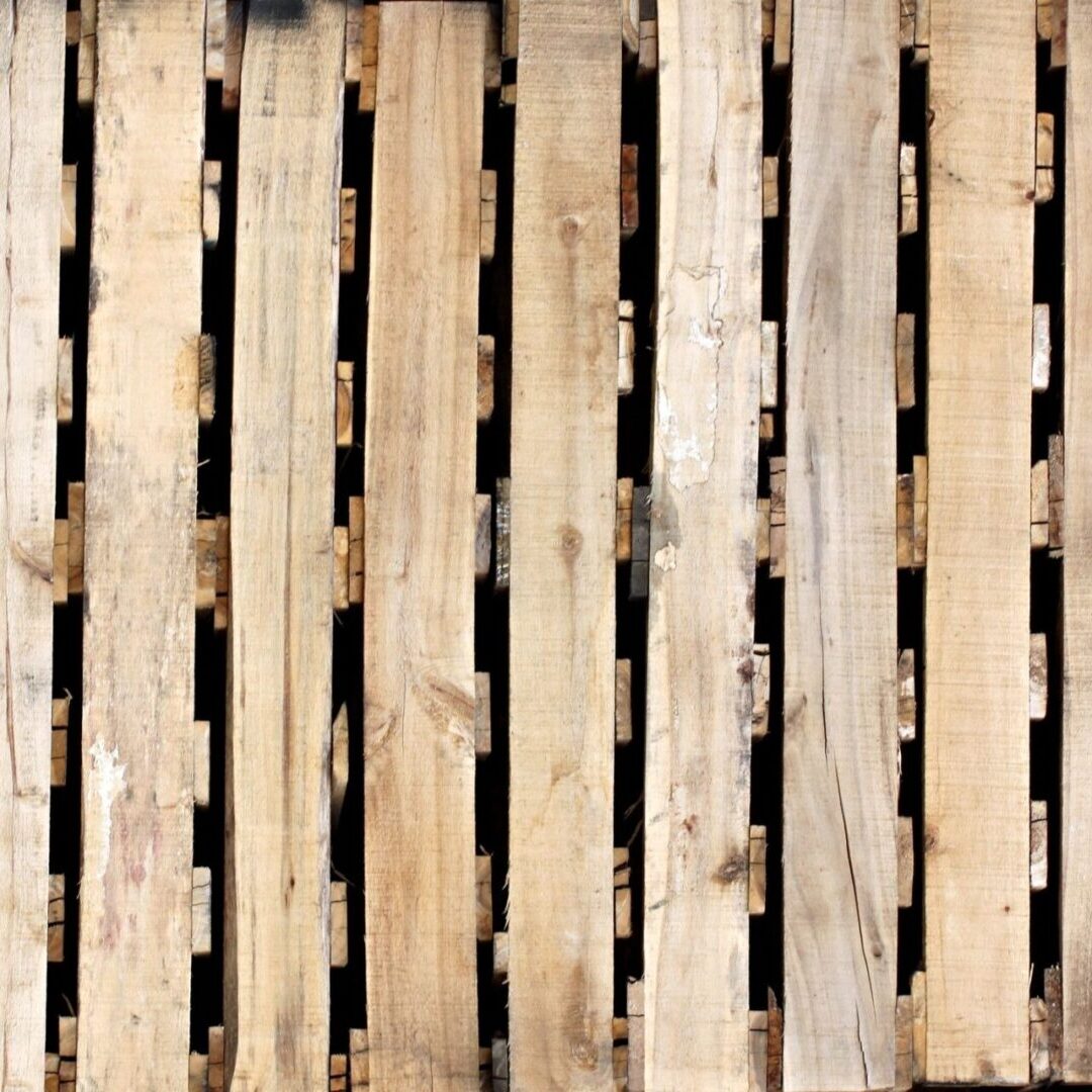 A wooden pallet with many slats on it.