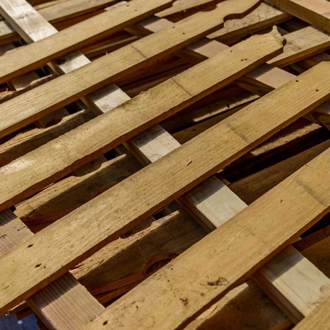 A wooden pallet with many pieces of wood on it.